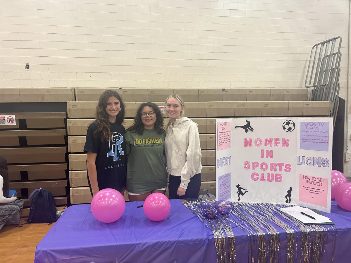 Vivian Kirk, Tori Chase, and Adrianna Brandon represent Women in Sports Club
